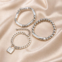Collezione di Braccialetti con Perle in Oro Bianco e Chiusura Stile Punk
