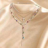 Parure di collana e orecchini in oro bianco con pietre multicolori