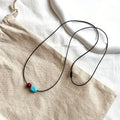 Collana con pendente in perle rotonde di turchese e cinnabro