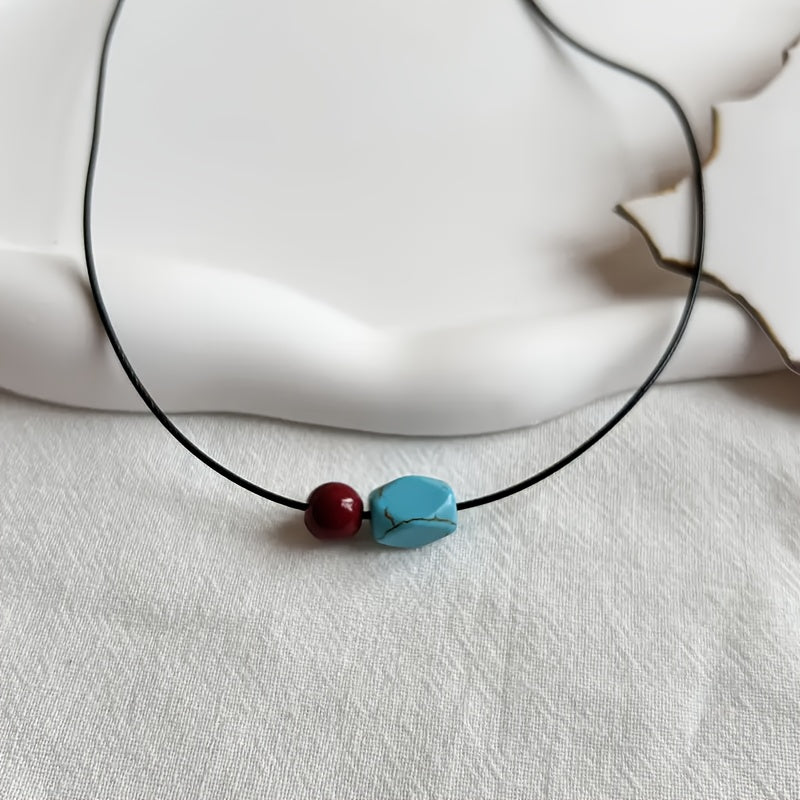 Collana con pendente in perle rotonde di turchese e cinnabro