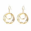 Orecchini a pendente doppi ad anello in oro martellato boho
