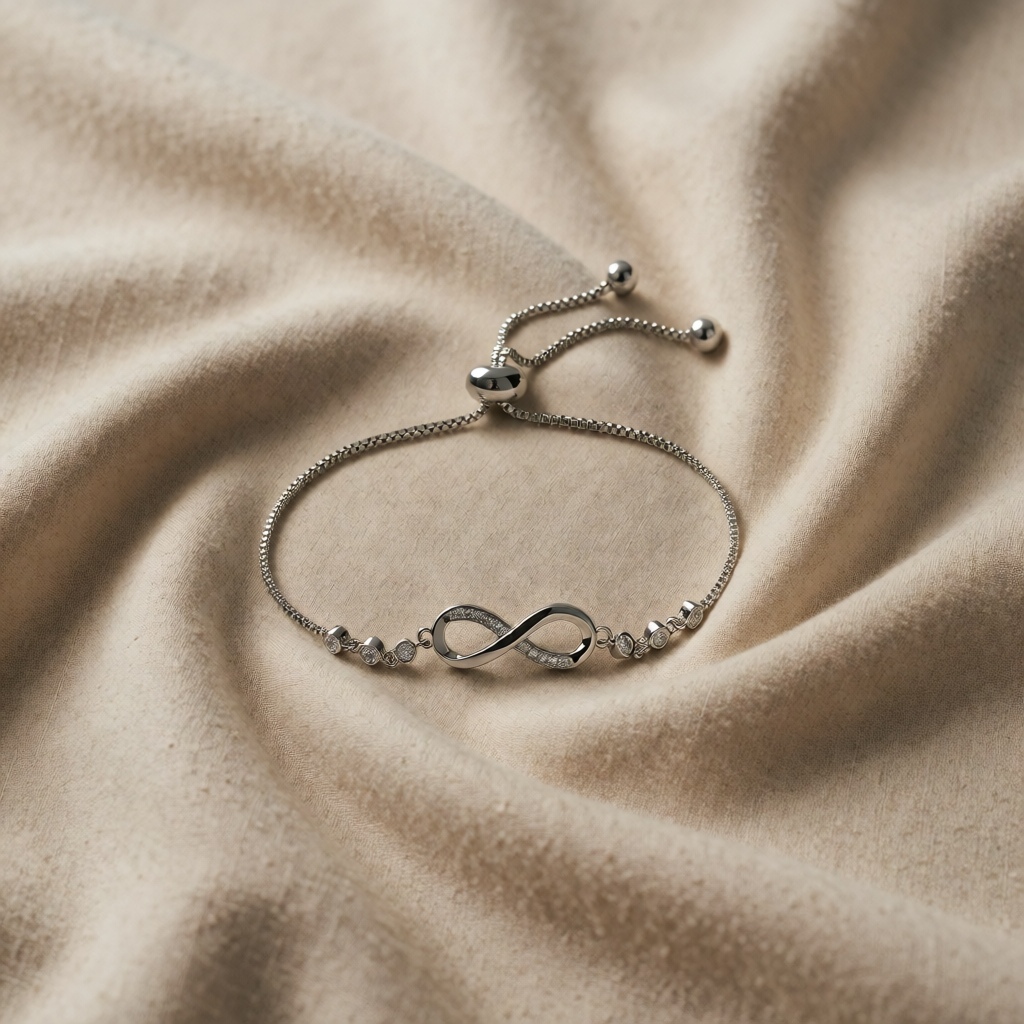 Bracciale scorrevole con simbolo dell'infinito in oro bianco