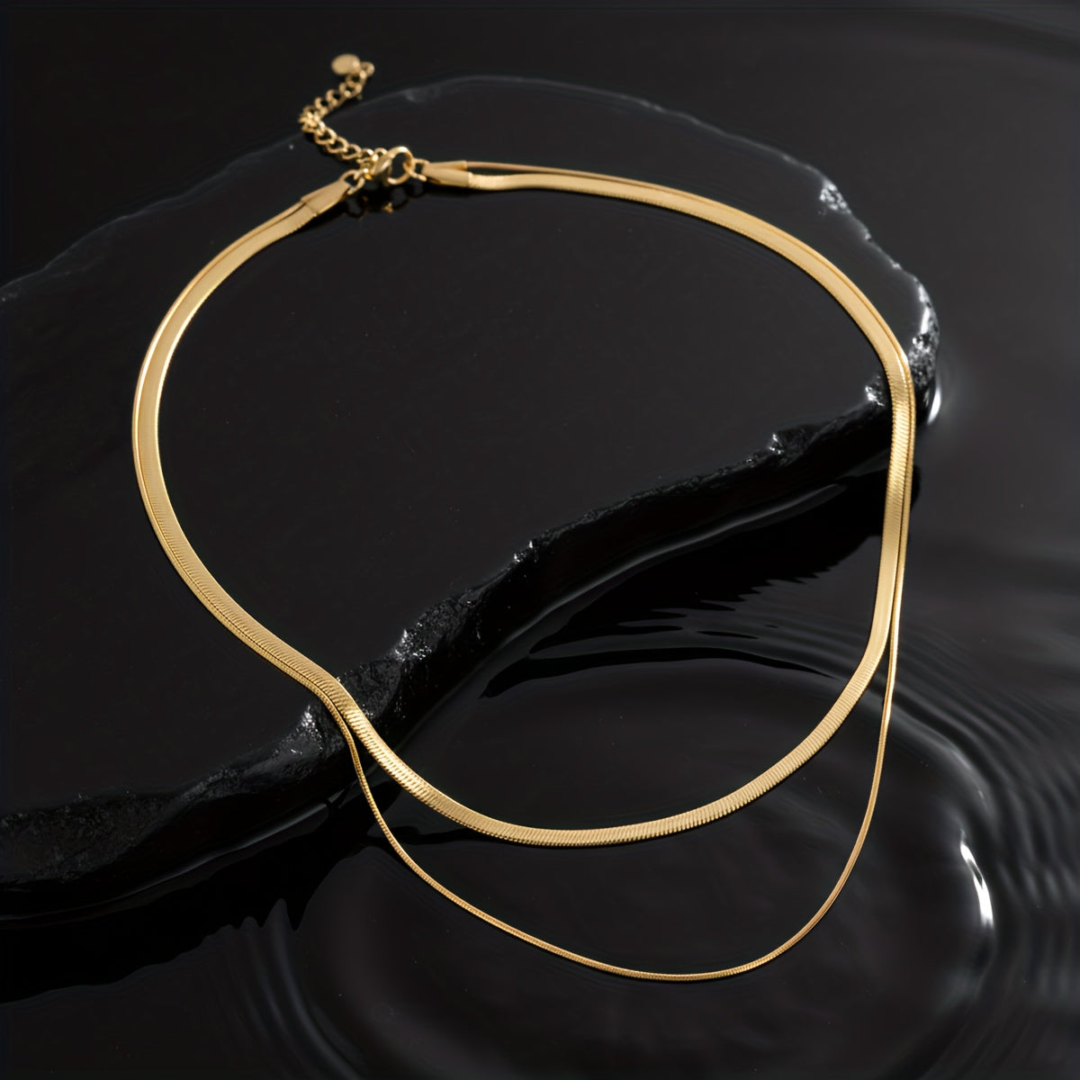 Collana a strati con serpenti in oro bianco