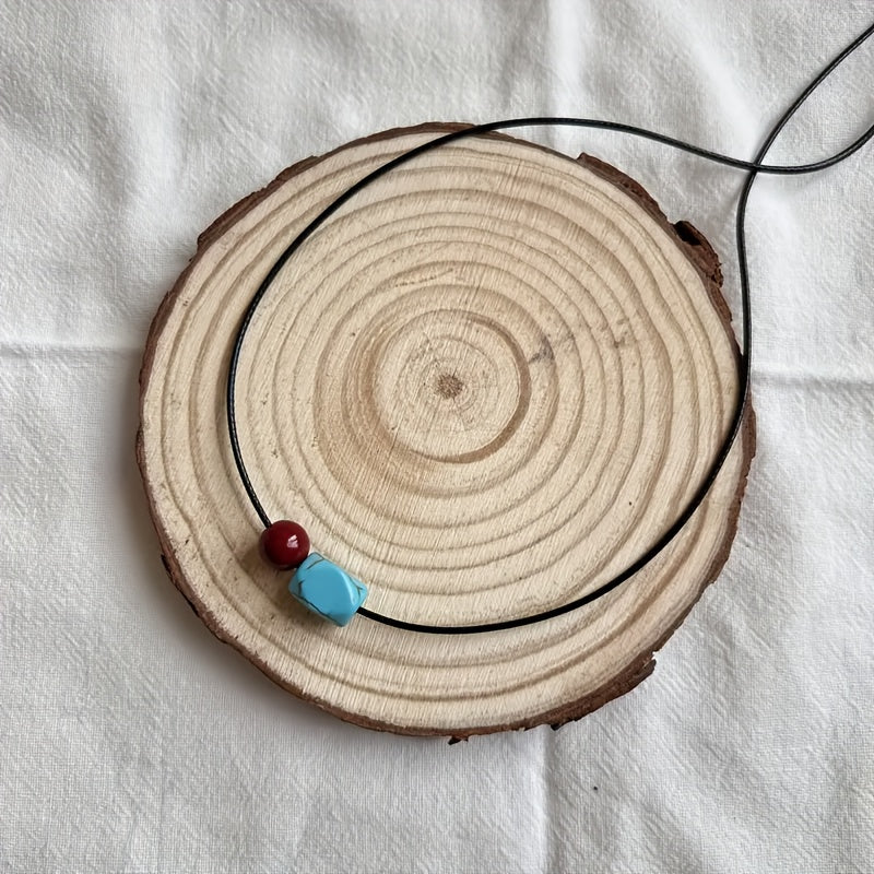 Collana con pendente in perle rotonde di turchese e cinnabro