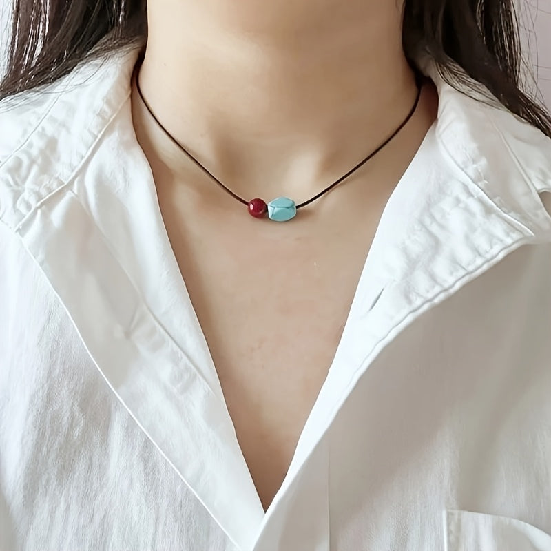 Collana con pendente in perle rotonde di turchese e cinnabro