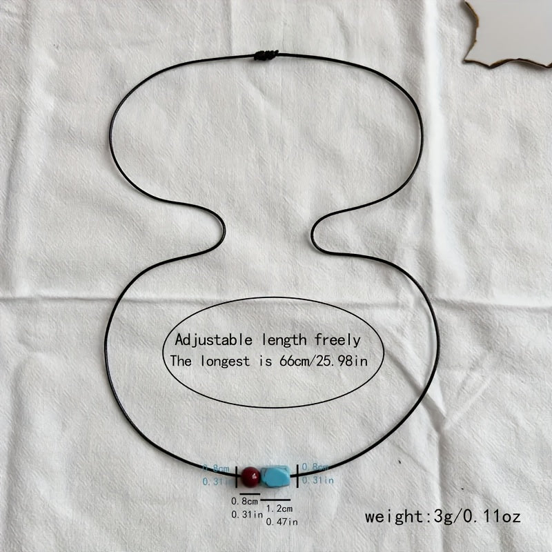 Collana con pendente in perle rotonde di turchese e cinnabro