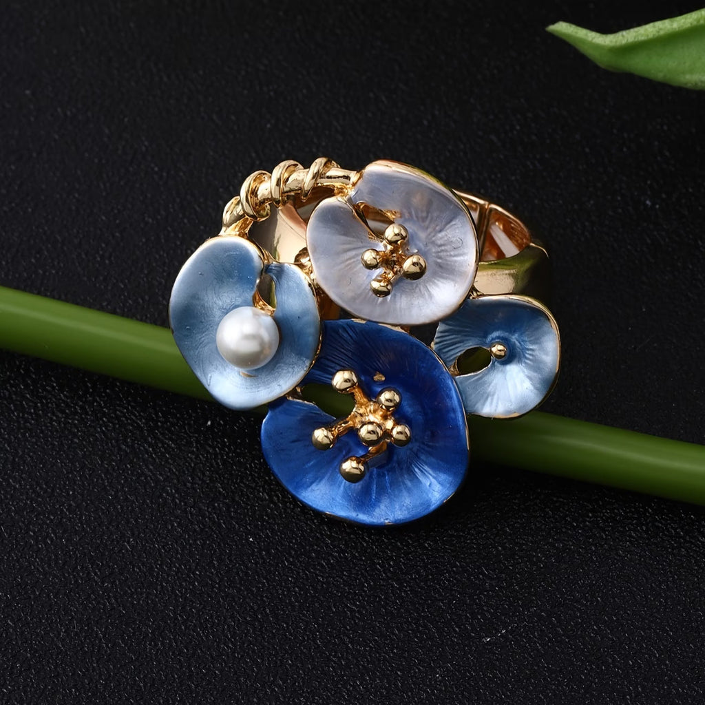 Anello dichiarativo regolabile in perle floreali blu