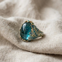 Nives™ - Elegante Anello in Oro con Fiore e Gemma Blu