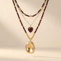 Collana a strati con cuore in granato dorato Boho